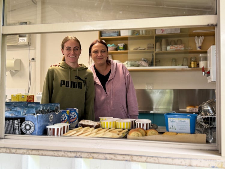 Two school parents standing in the school canteen